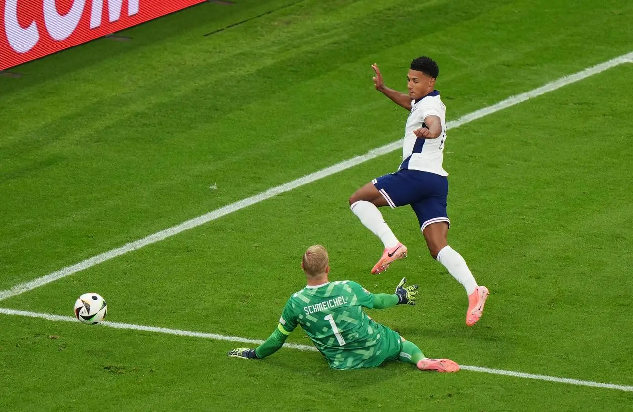 Denmark goalkeeper Kasper Schmeichel saves from England’s Ollie Watkins during a Euro 2024 match