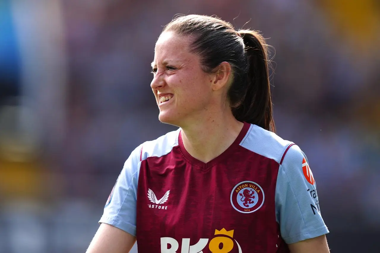 Danielle Turner looks into the distance while wearing an Aston Villa kit