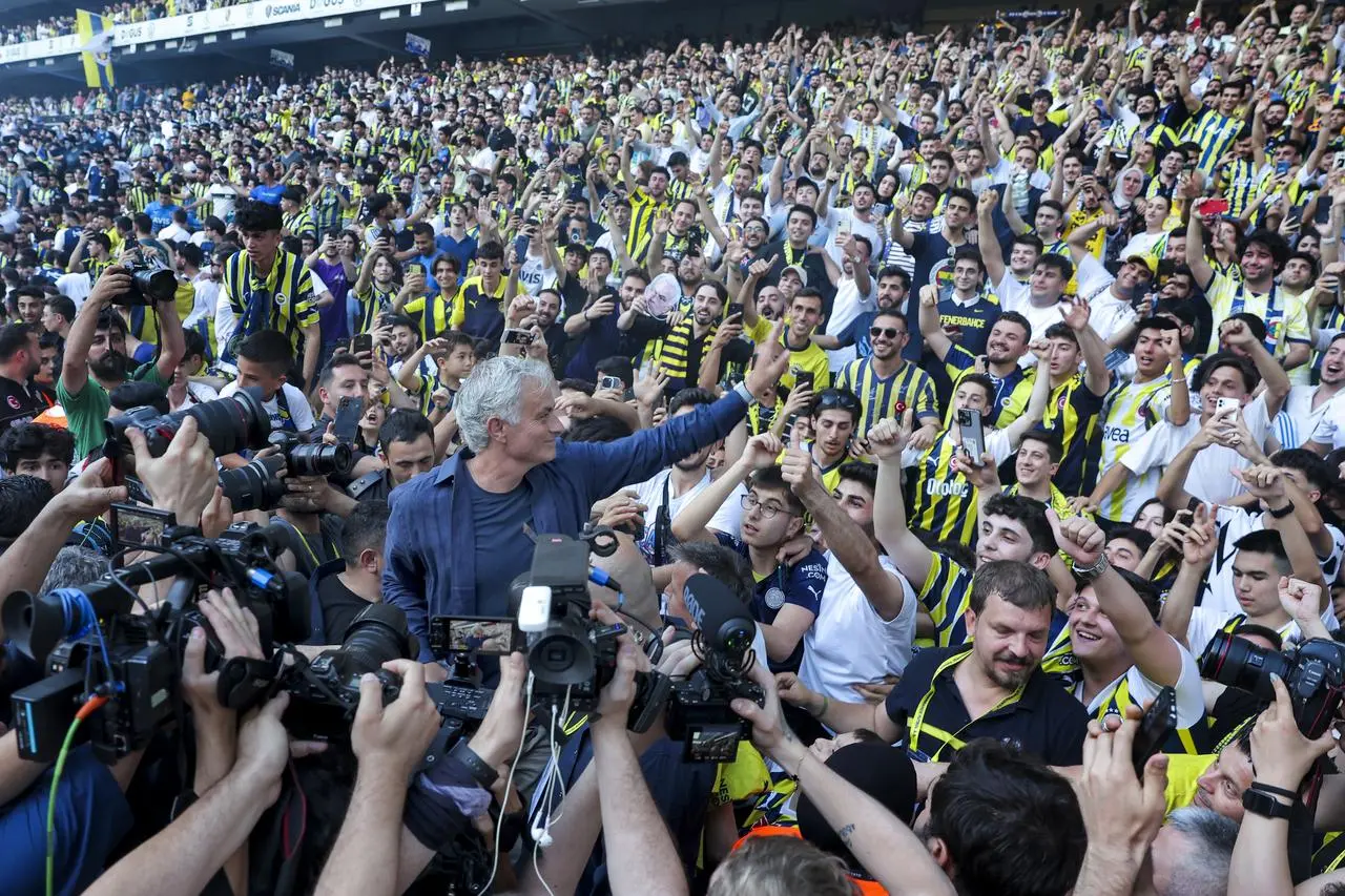 Jose Mourinho waves to fans
