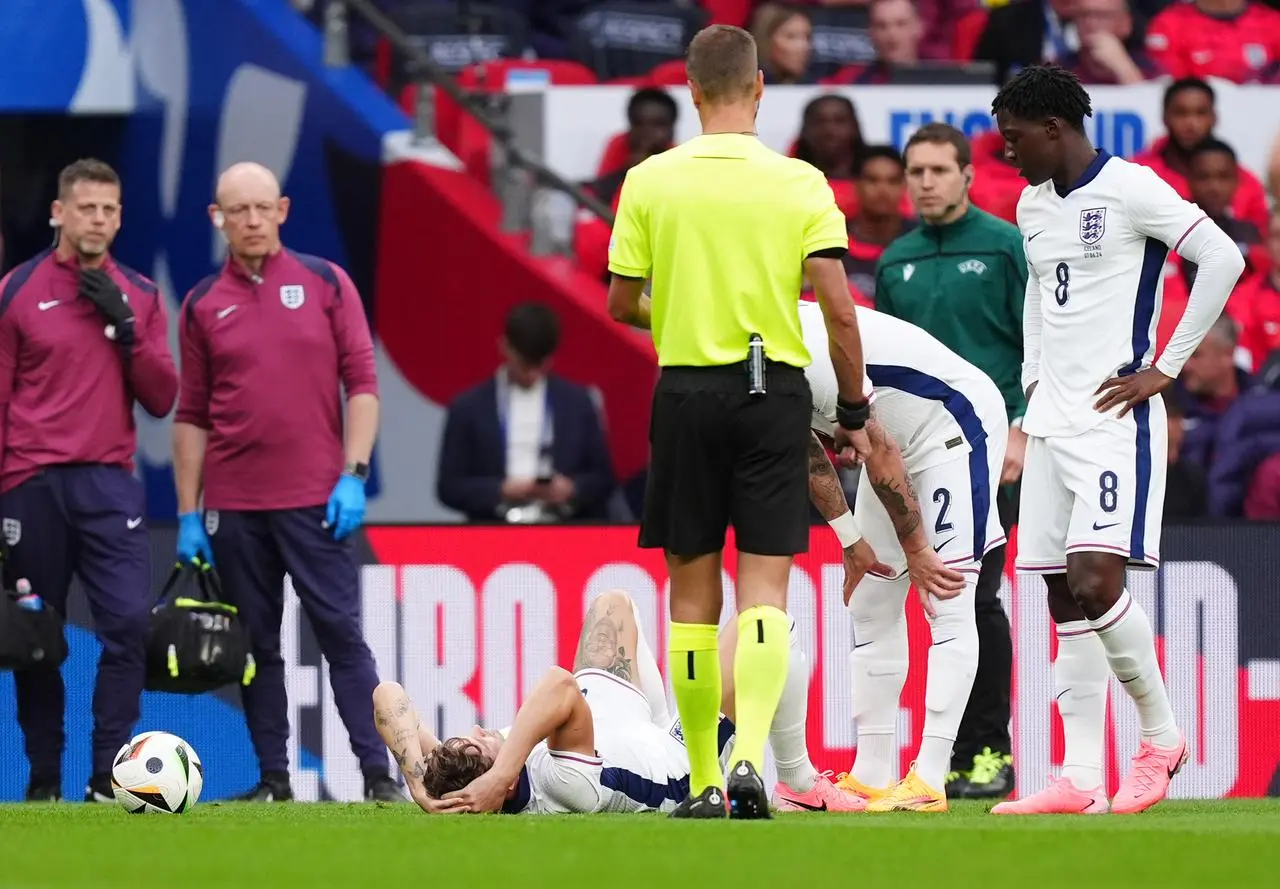 England’s John Stones lies in pain after picking up an injury during the friendly against Iceland