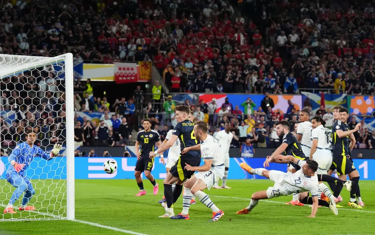 Scotland's Grant Hanley hits the post during his side's Euro 2024 match against Switzerland 