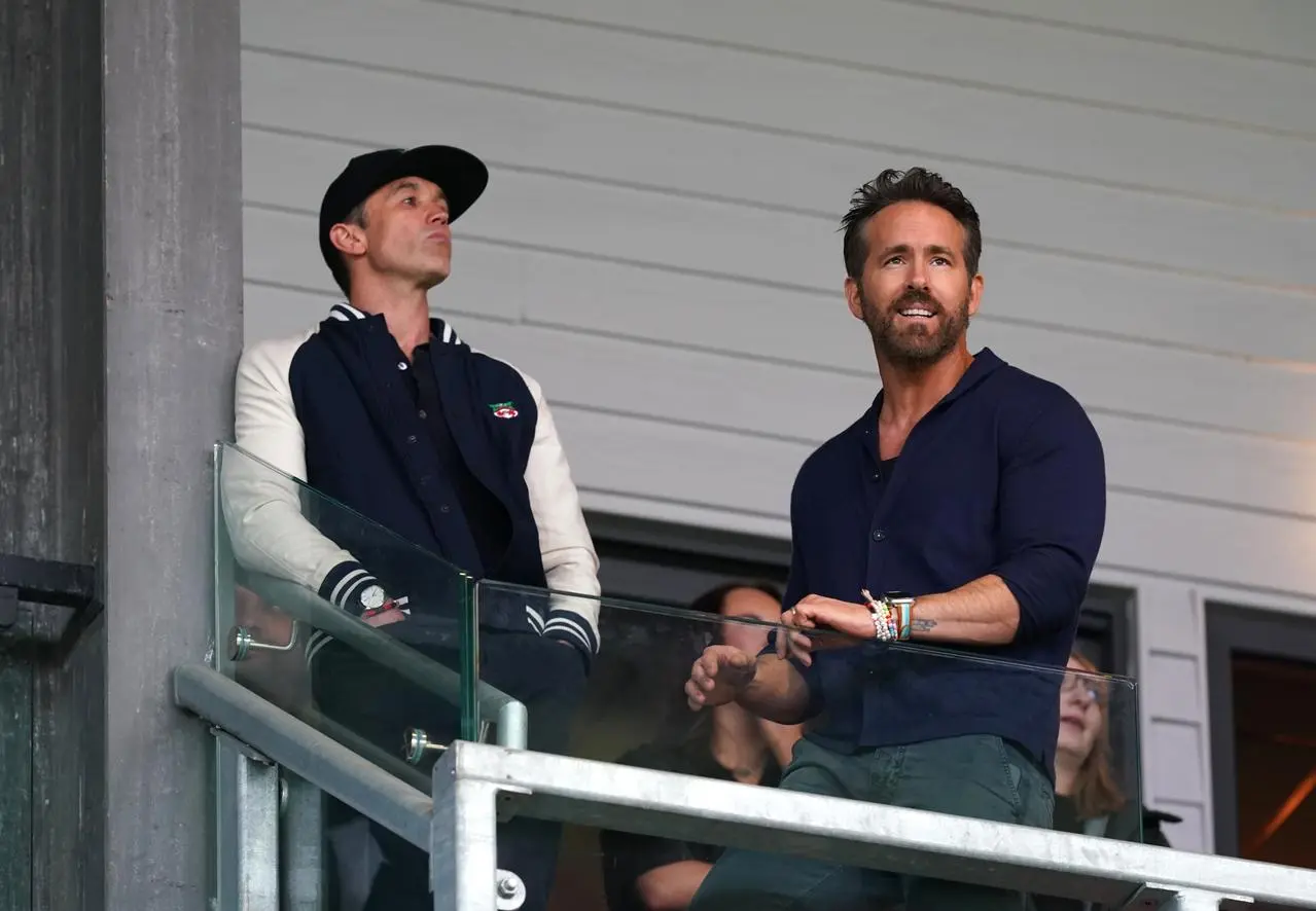 Rob McElhenney and Ryan Reynolds watch Wrexham from the stands