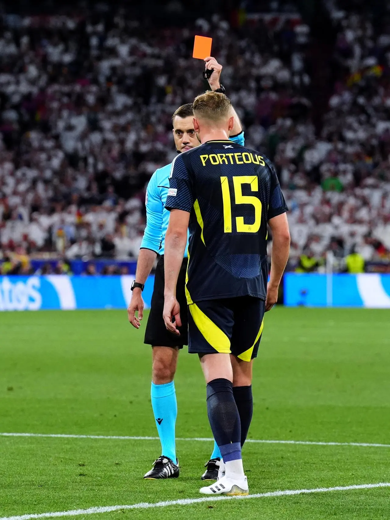 Scotland defender Ryan Porteous is shown a red card