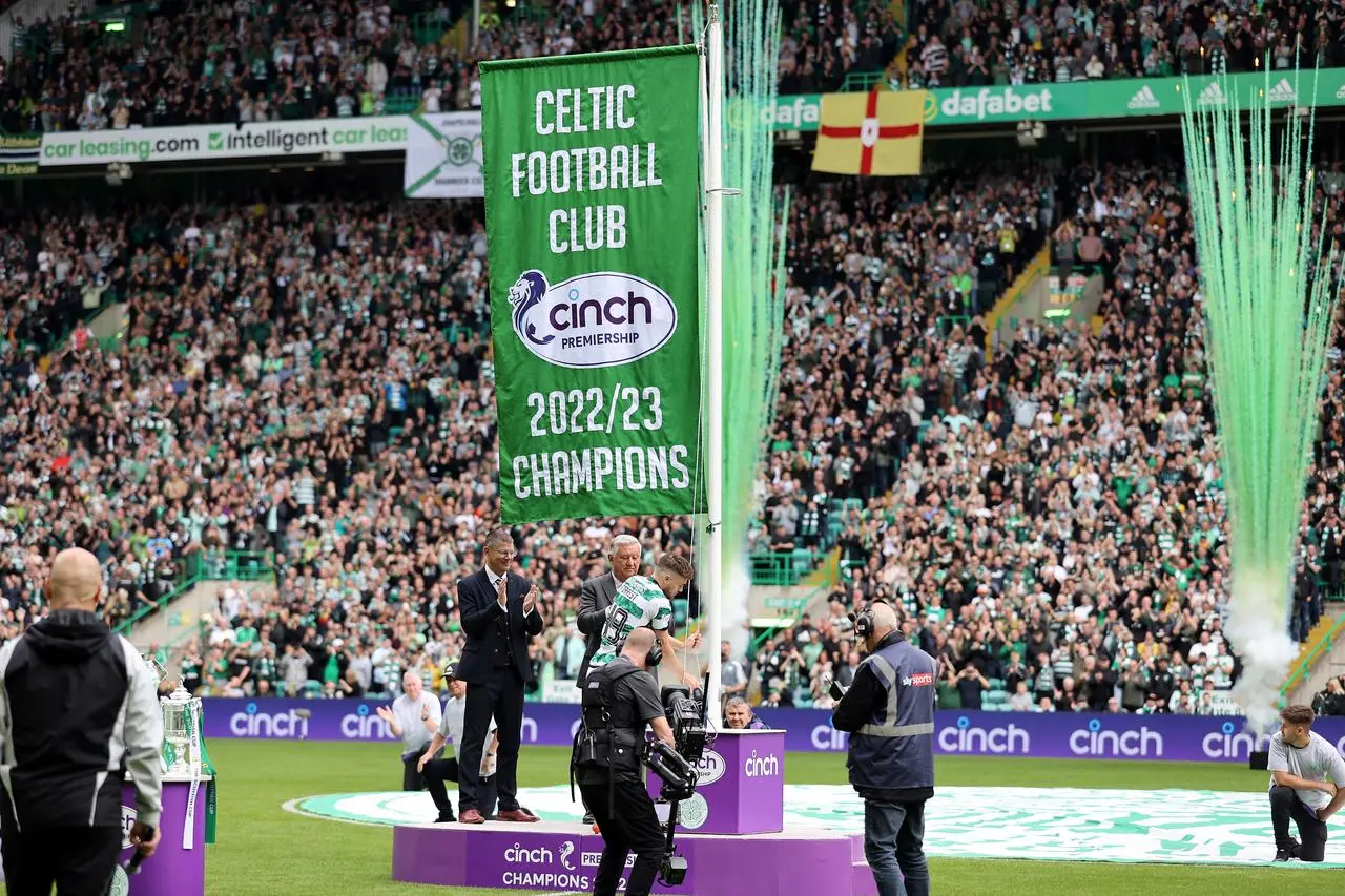 The league flag is raised at Celtic Park