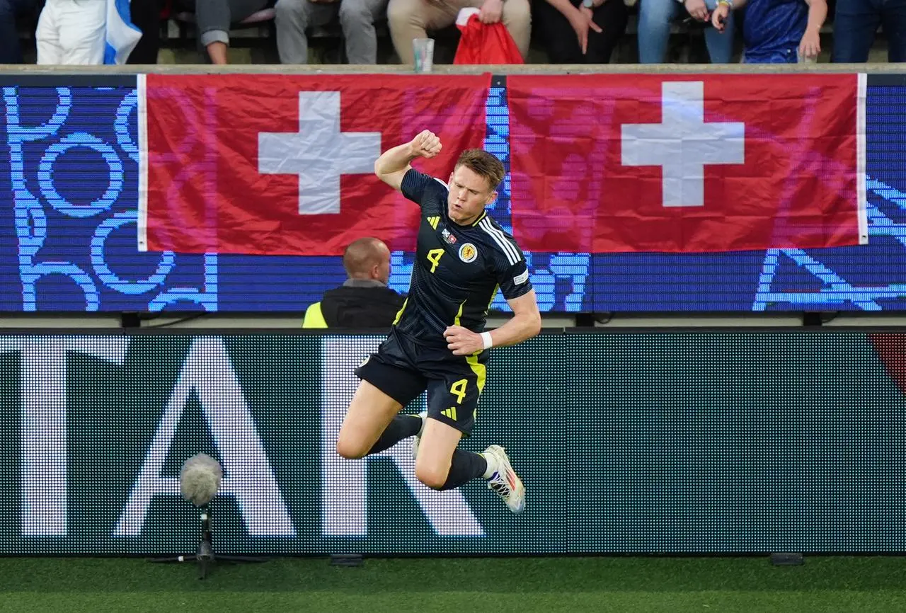 Scott McTominay jumps for joy as he celebrates scoring Scotland's opening goal