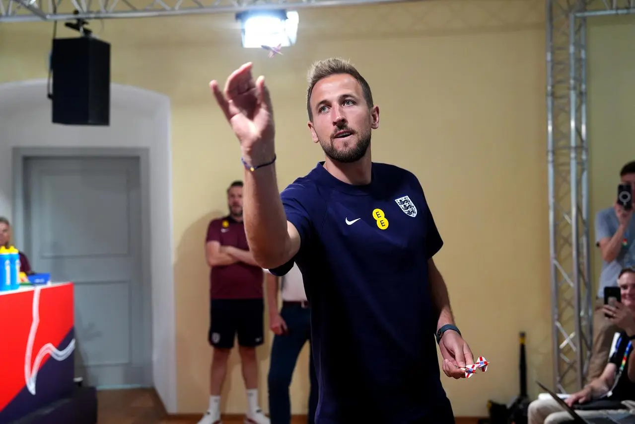 England’s Harry Kane playing darts during a media day at the team's Euro 2024 base in Blankenhain