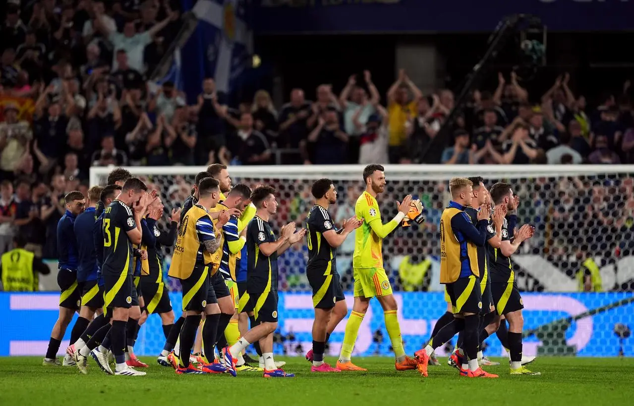 Scotland players applaud the fans