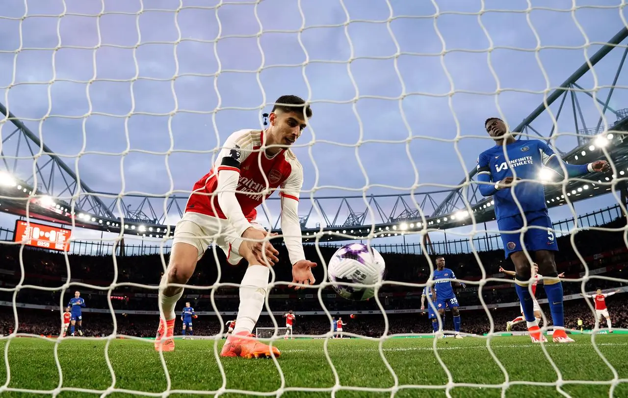 Arsenal’s Kai Havertz collects the ball after scoring against Chelsea
