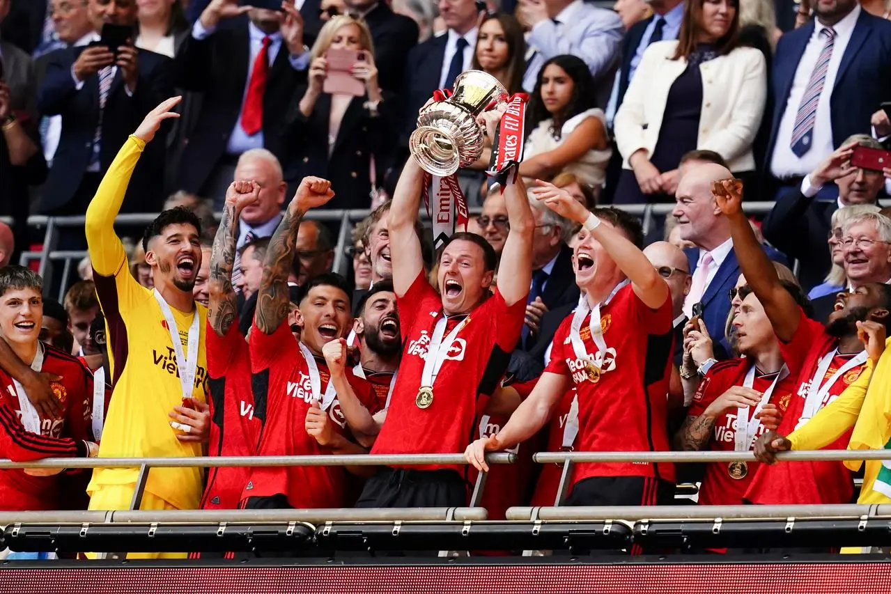 Manchester United's players lift the FA Cup at Wembley