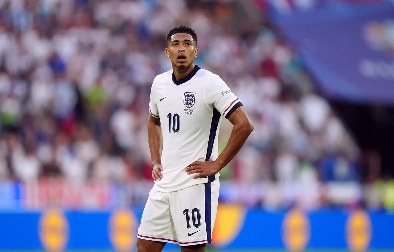 Jude Bellingham looks tired as he puts both hands on his hips during England's draw with Slovenia