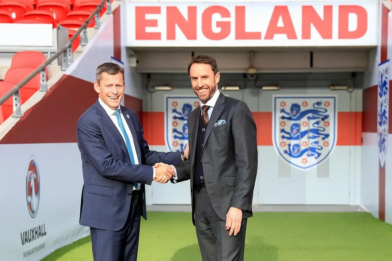 Gareth Southgate, right, shakes hands with Martin Glenn following his appointment as England boss