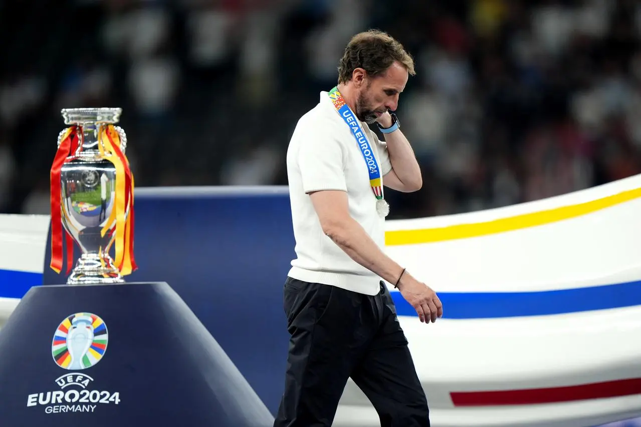 Gareth Southgate walks past the Euro 2024 trophy after his team's 2-1 defeat to Spain in the final in Berlin