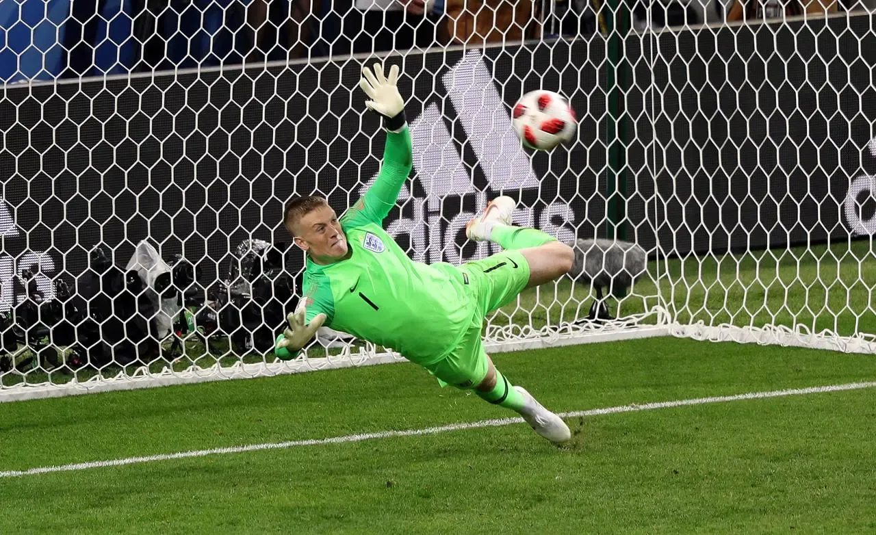 England goalkeeper Jordan Pickford throws himself to his right to save a penalty from Colombia’s Carlos Bacca during the 2018 World Cup