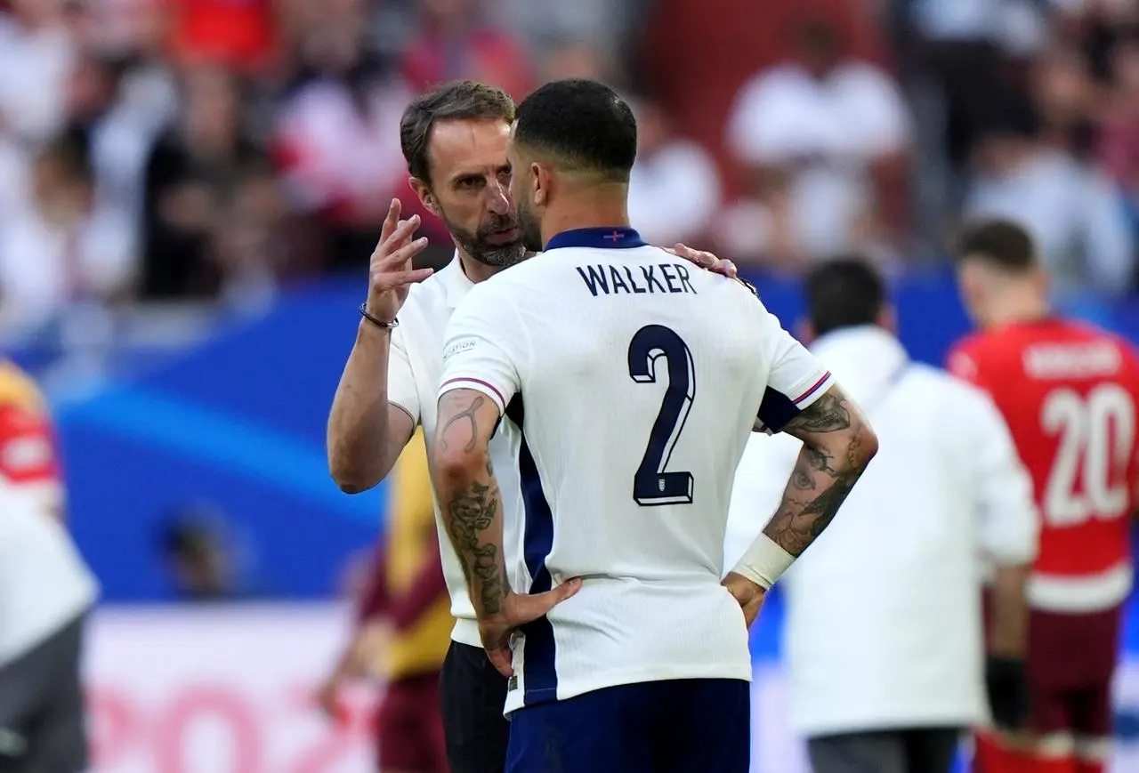 England manager Gareth Southgate speaks with Kyle Walker