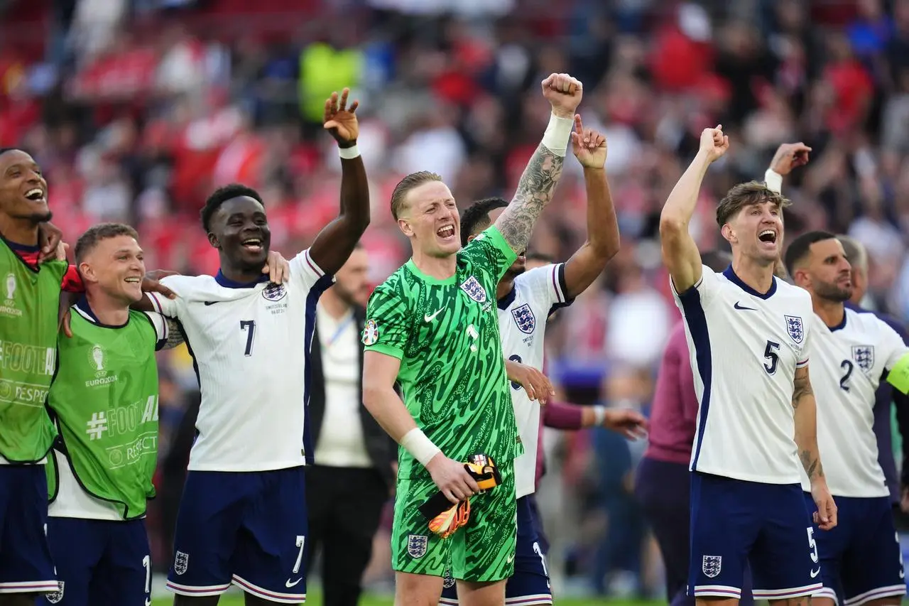 England players celebrate their win over Switzerland