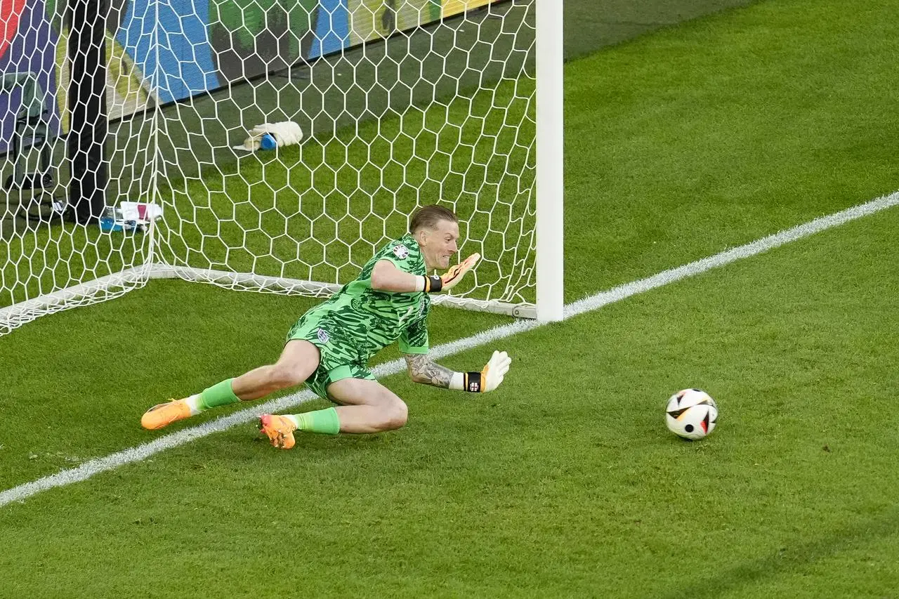 England goalkeeper Jordan Pickford saves the penalty from Switzerland’s Manuel Akanji (not pictured)