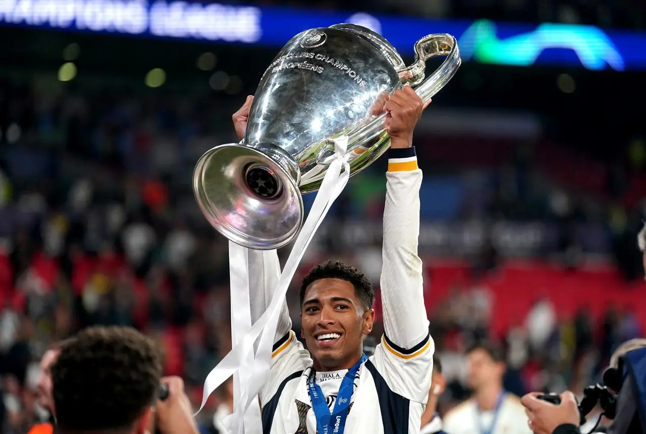 Real Madrid’s Jude Bellingham celebrates with the trophy after winning the Champions League final at Wembley