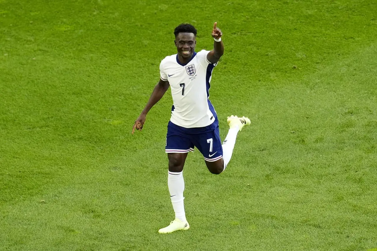 England’s Bukayo Saka celebrates after scoring the equaliser against Switzerland