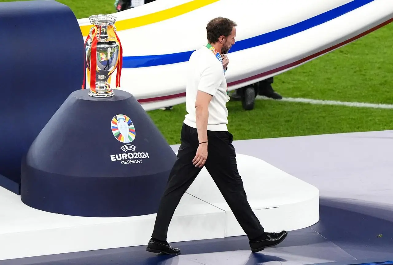 England manager Gareth Southgate walks past the Henri Delaunay Cup following defeat to Spain