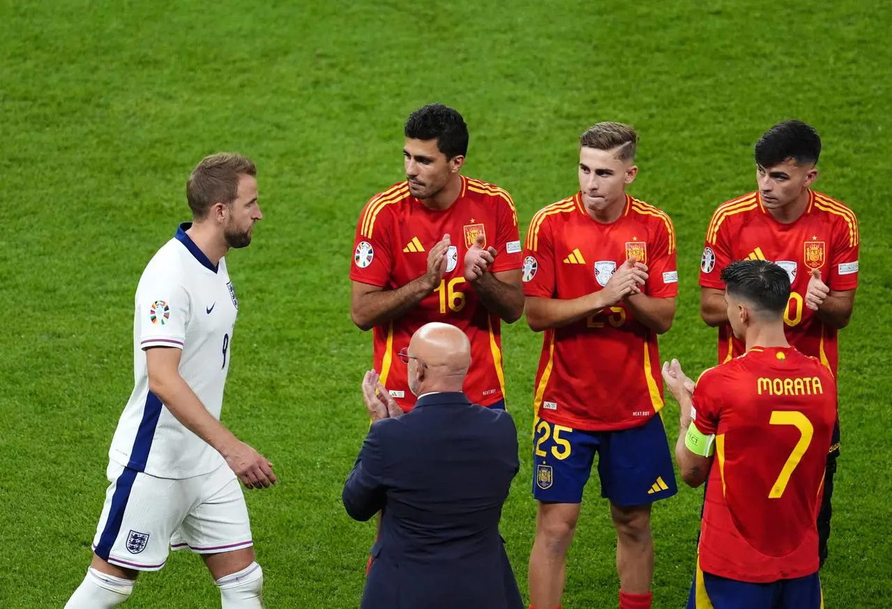 England captain Harry Kane is applauded by victorious Spain players following the Euro 2024 final