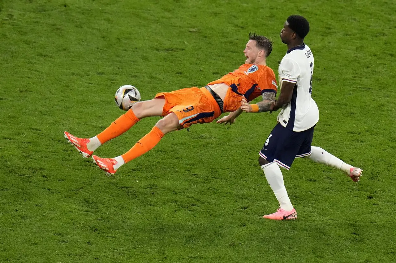 England’s Marc Guehi fights for the ball against Wout Weghorst of the Netherlands during the Euro 2024 semi-final