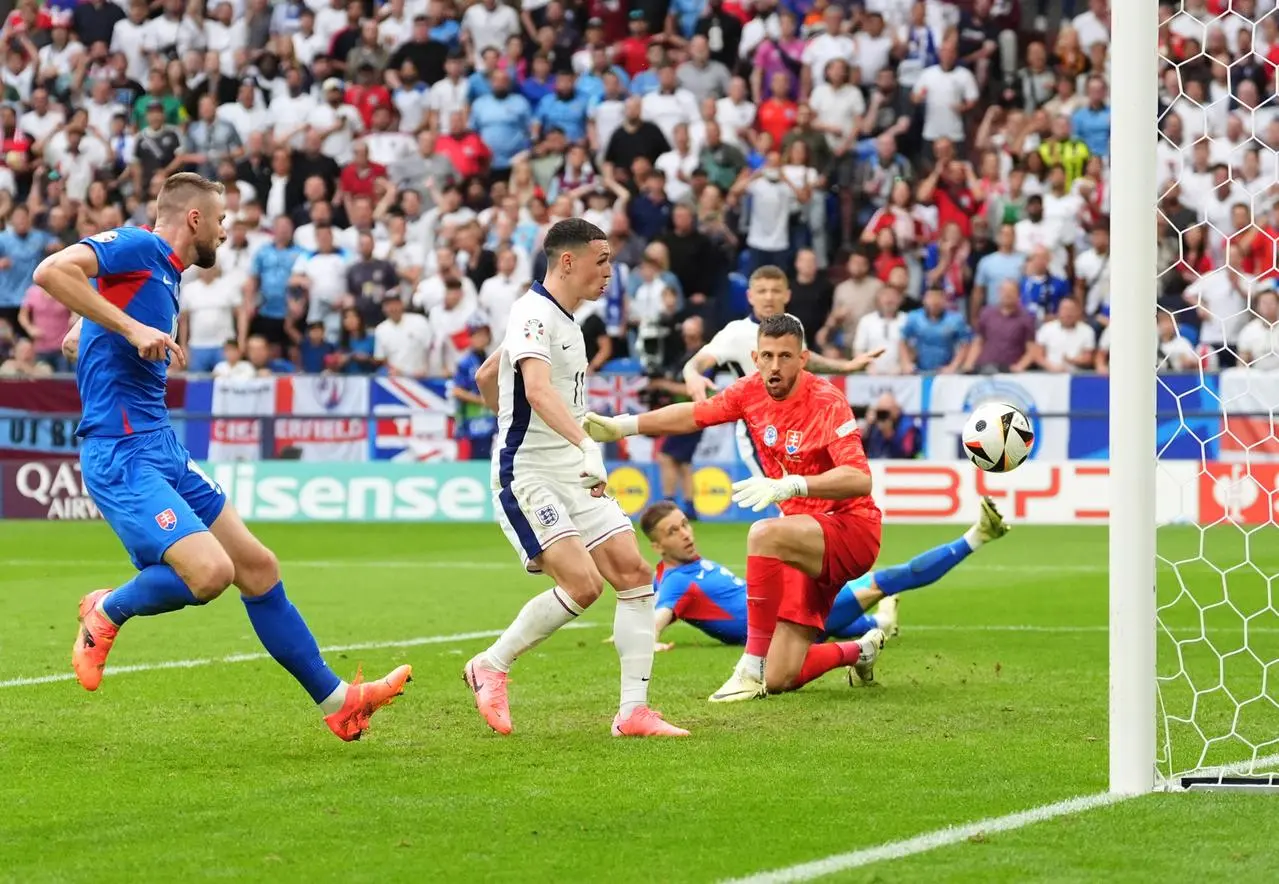 England’s Phil Foden scores before the goal is ruled out for offside during the game against Slovakia