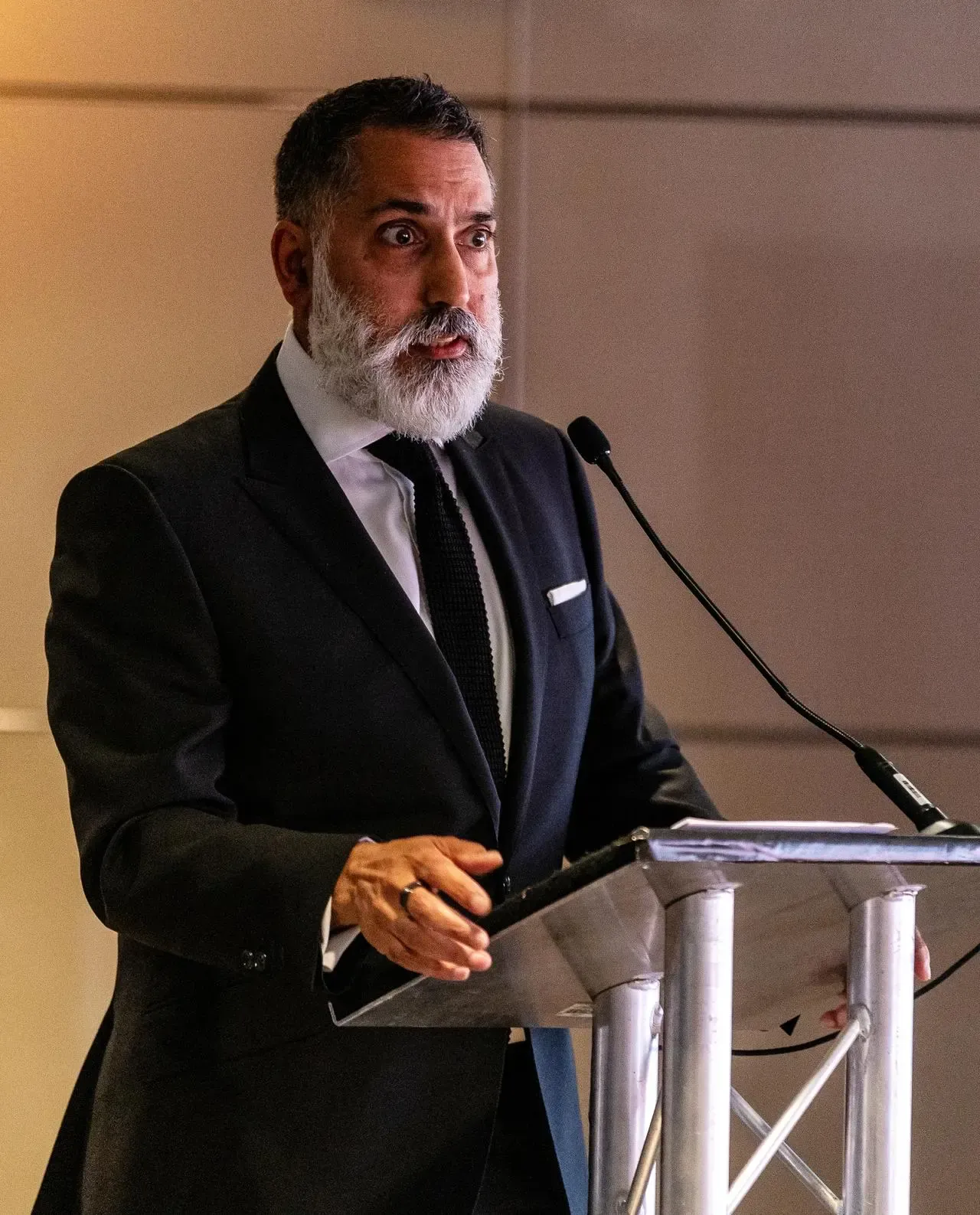 Kick It Out chair Sanjay Bhandari gives a speech at the charity's 30th anniversary event in 2023