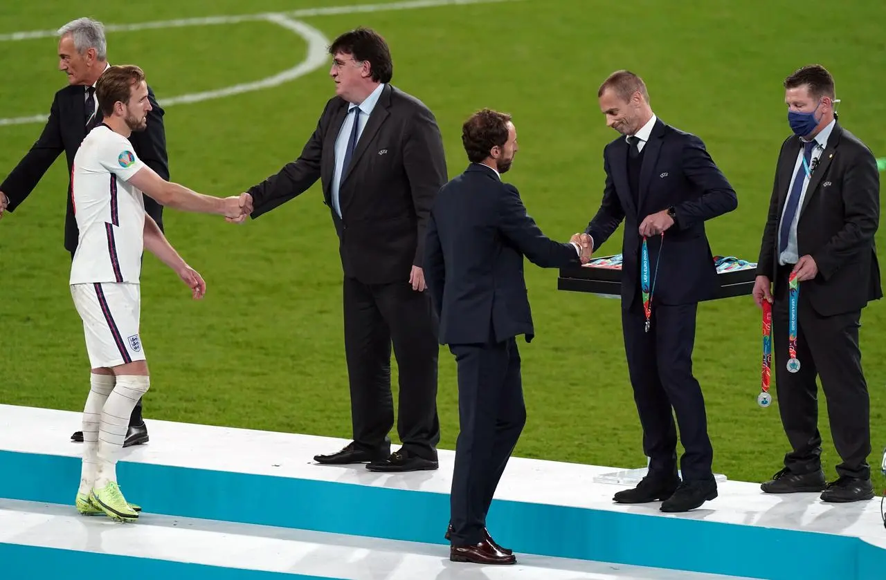 England manager Gareth Southgate receives his runners-up medal from UEFA president Aleksander Ceferin following the Euro 2020 final at Wembley 