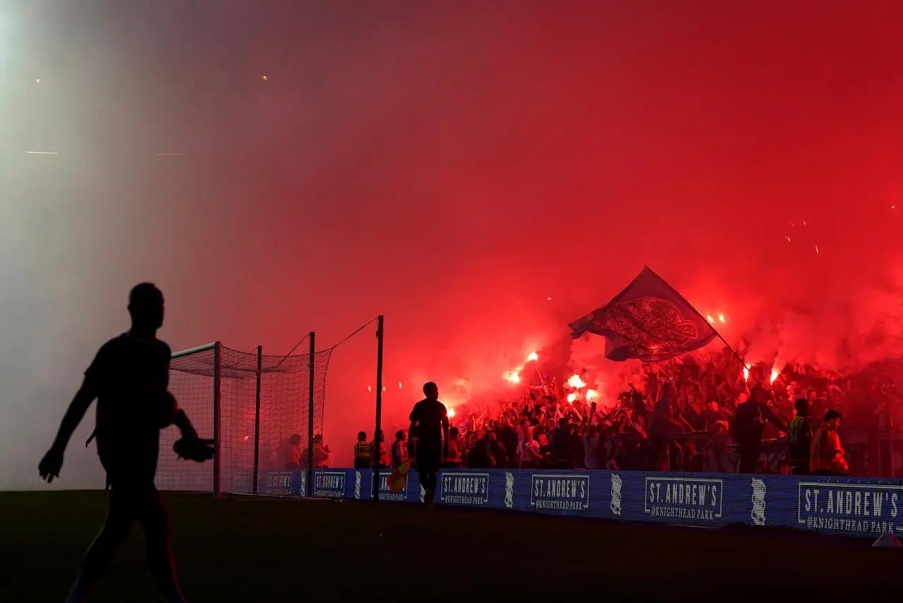 Rangers fans set off flares in the stands during the Trevor Francis Memorial match