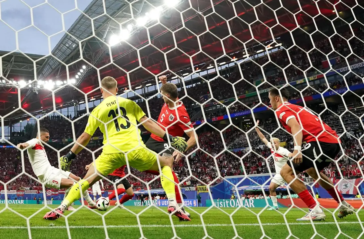 Turkey's Merih Demiral scores from close range to open the scoring against Austria in a Euro 2024 last-16 match