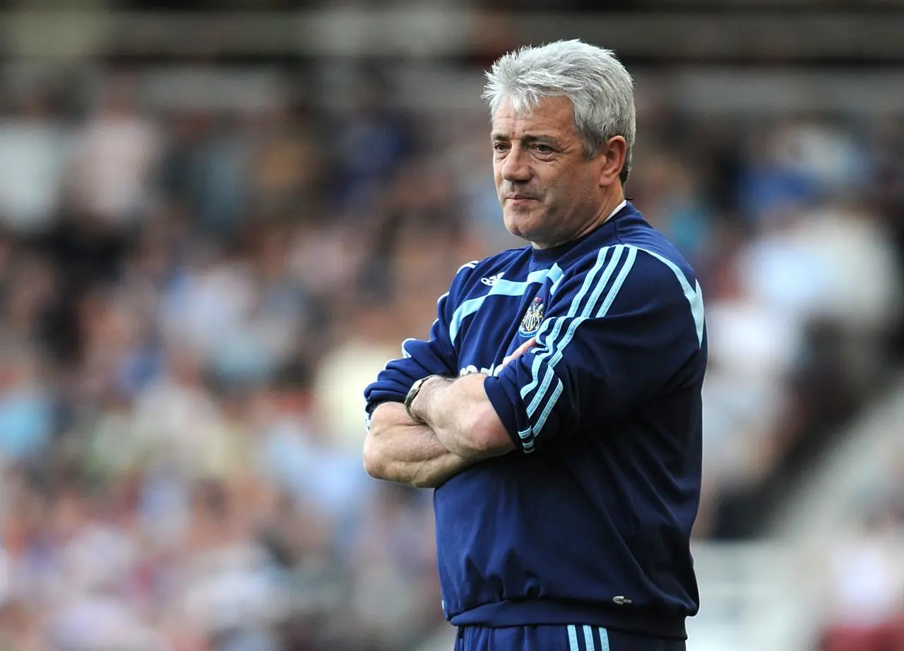 Kevin Keegan stands on the touchline with arms folded