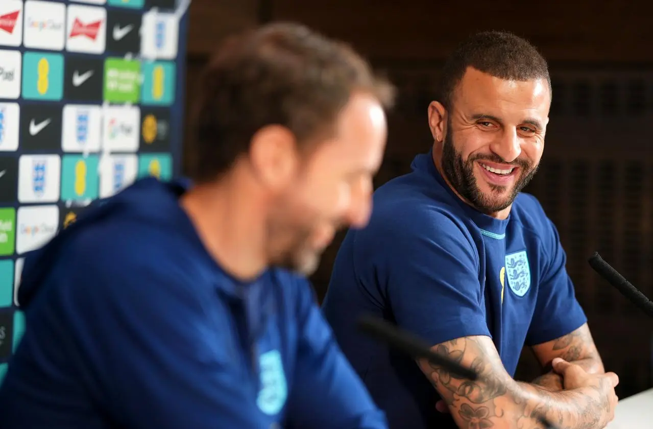 Kyle Walker, right, and manager Gareth Southgate share a laugh at an England press conference