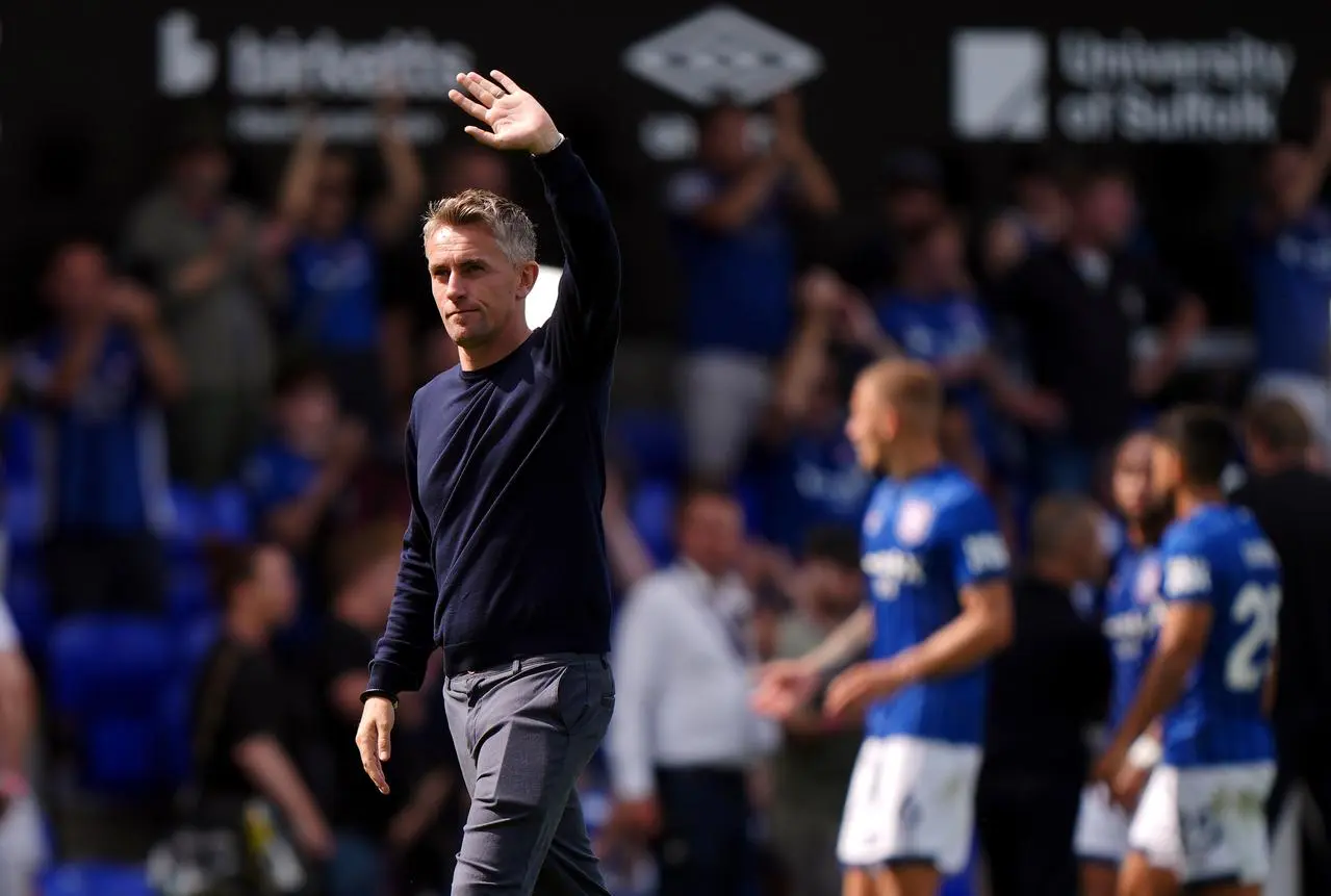 Ipswich manager Kieran McKenna waves to fans 