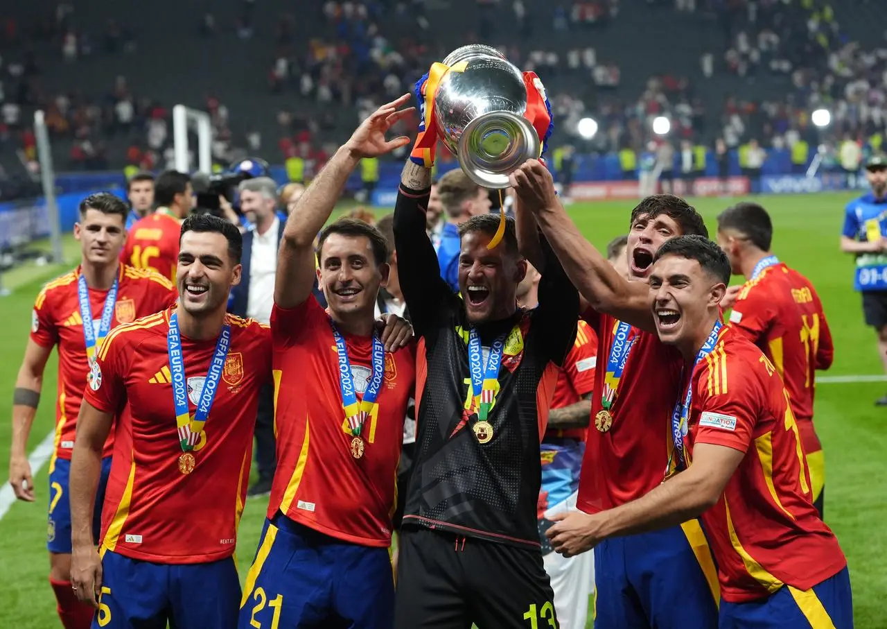 Mikel Merino, Mikel Oyarzabal, Alejandro Remiro, Robin Le Normand and Martin Zubimendi celebrate with the Euro 2024 trophy