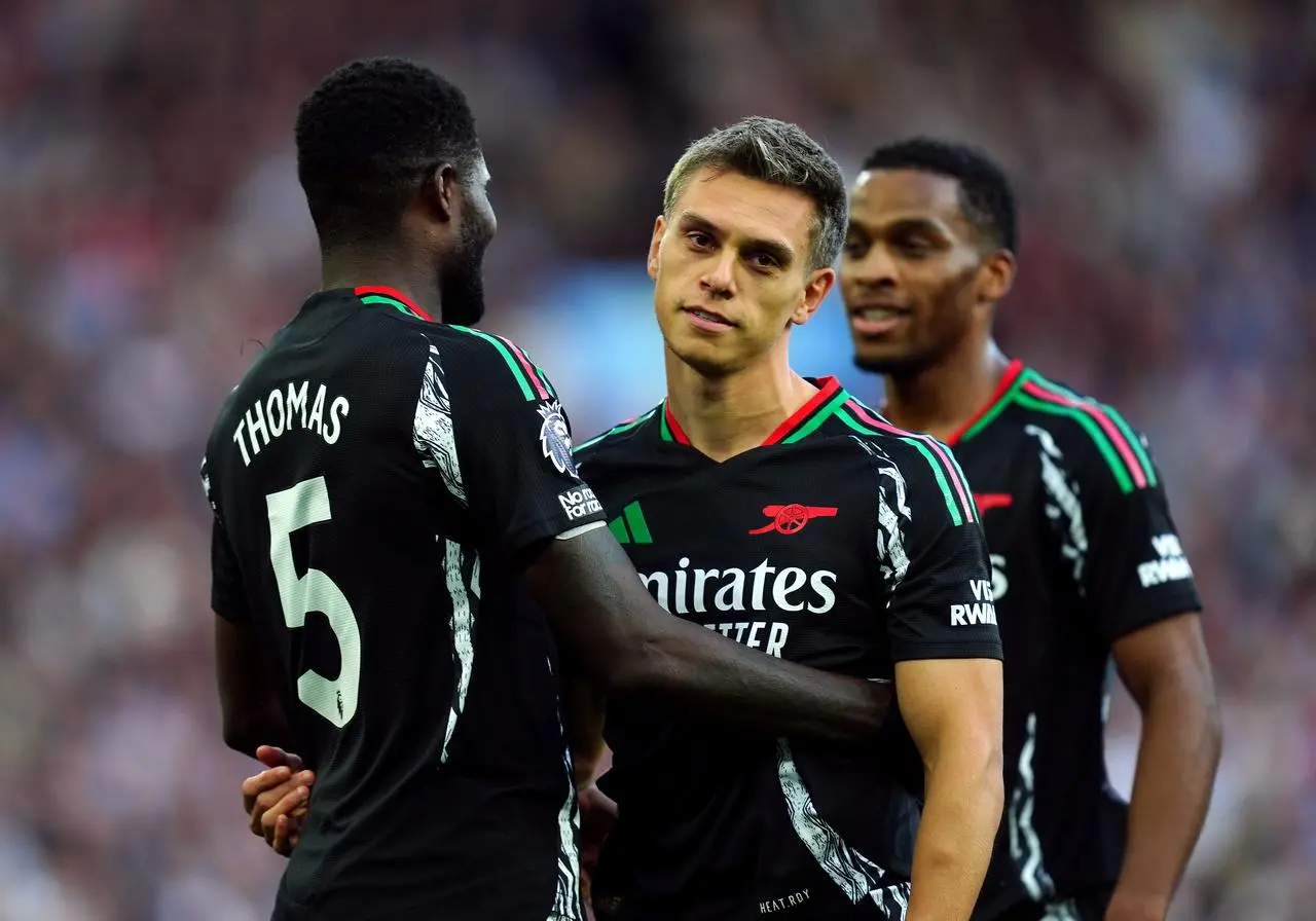 Leandro Trossard, right, is congratulated by Thomas Partey after opening the scoring against Aston Villa