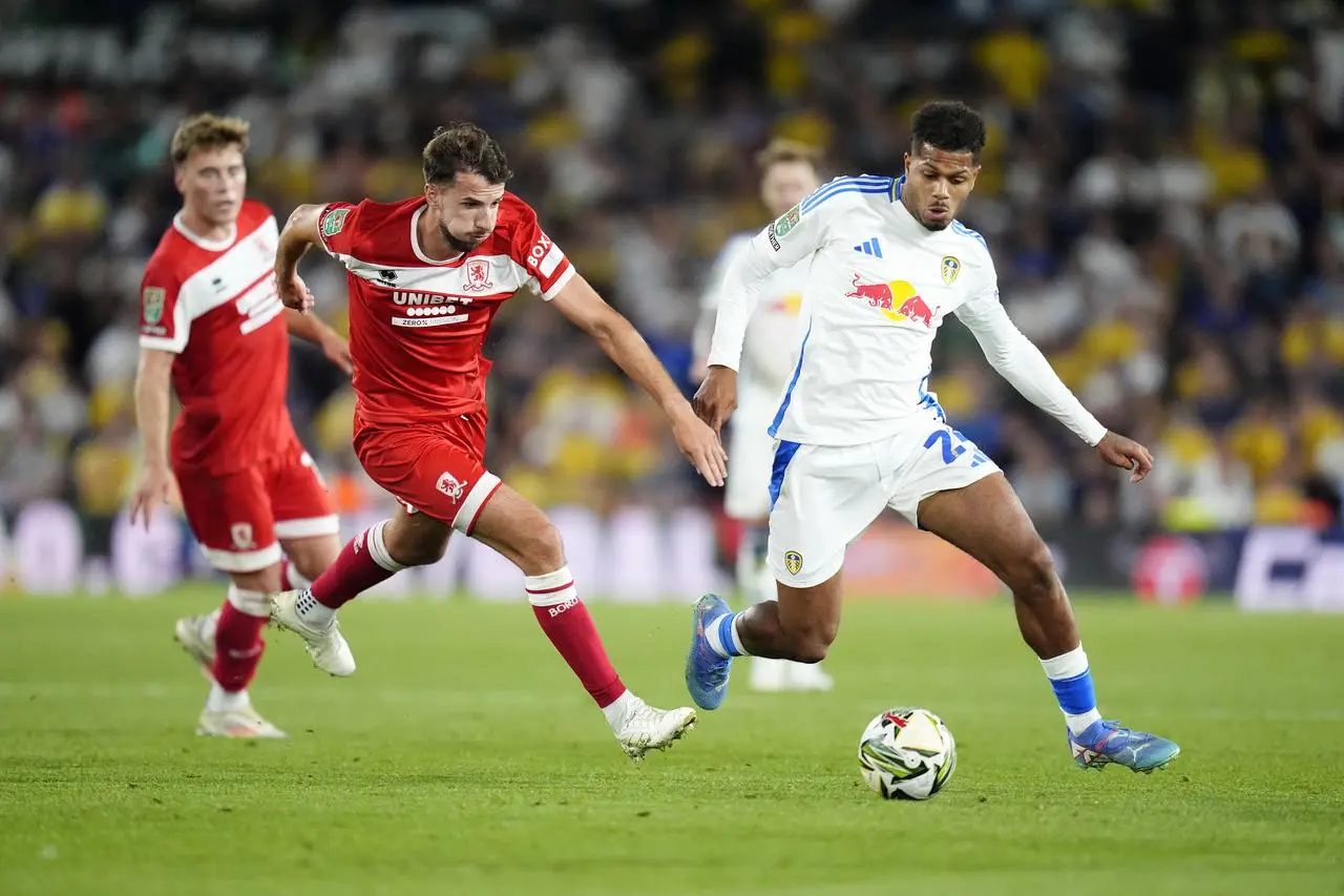 Georginio Rutter runs towards the ball ahead of a Middlesbrough player