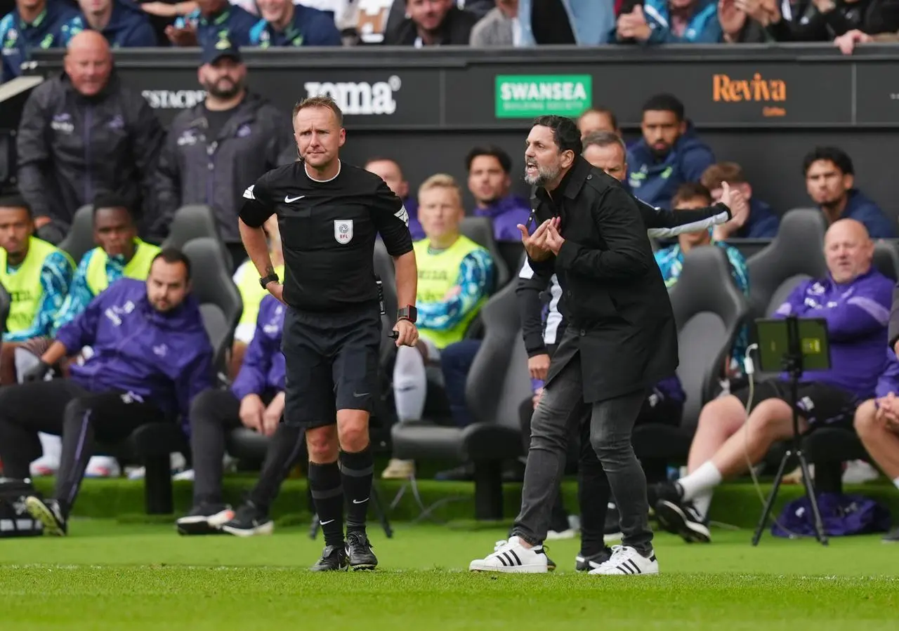 Erol Bulut argues with the referee