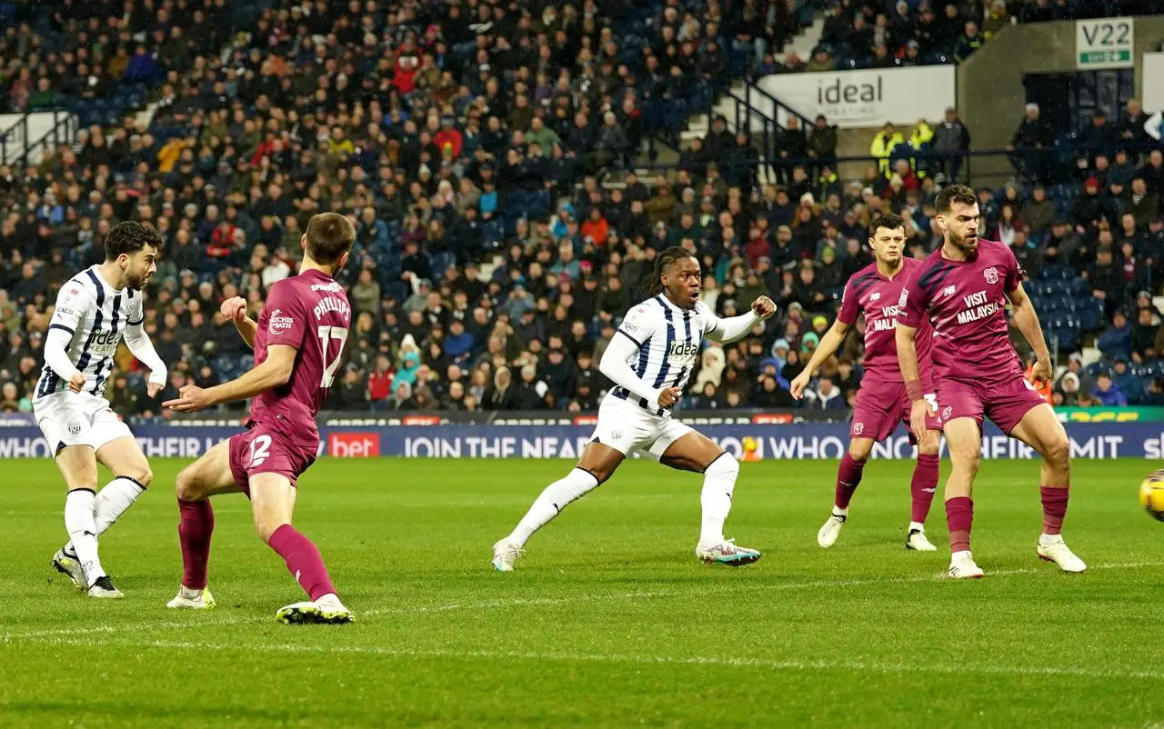 Mikey Johnston. left, scores for West Brom