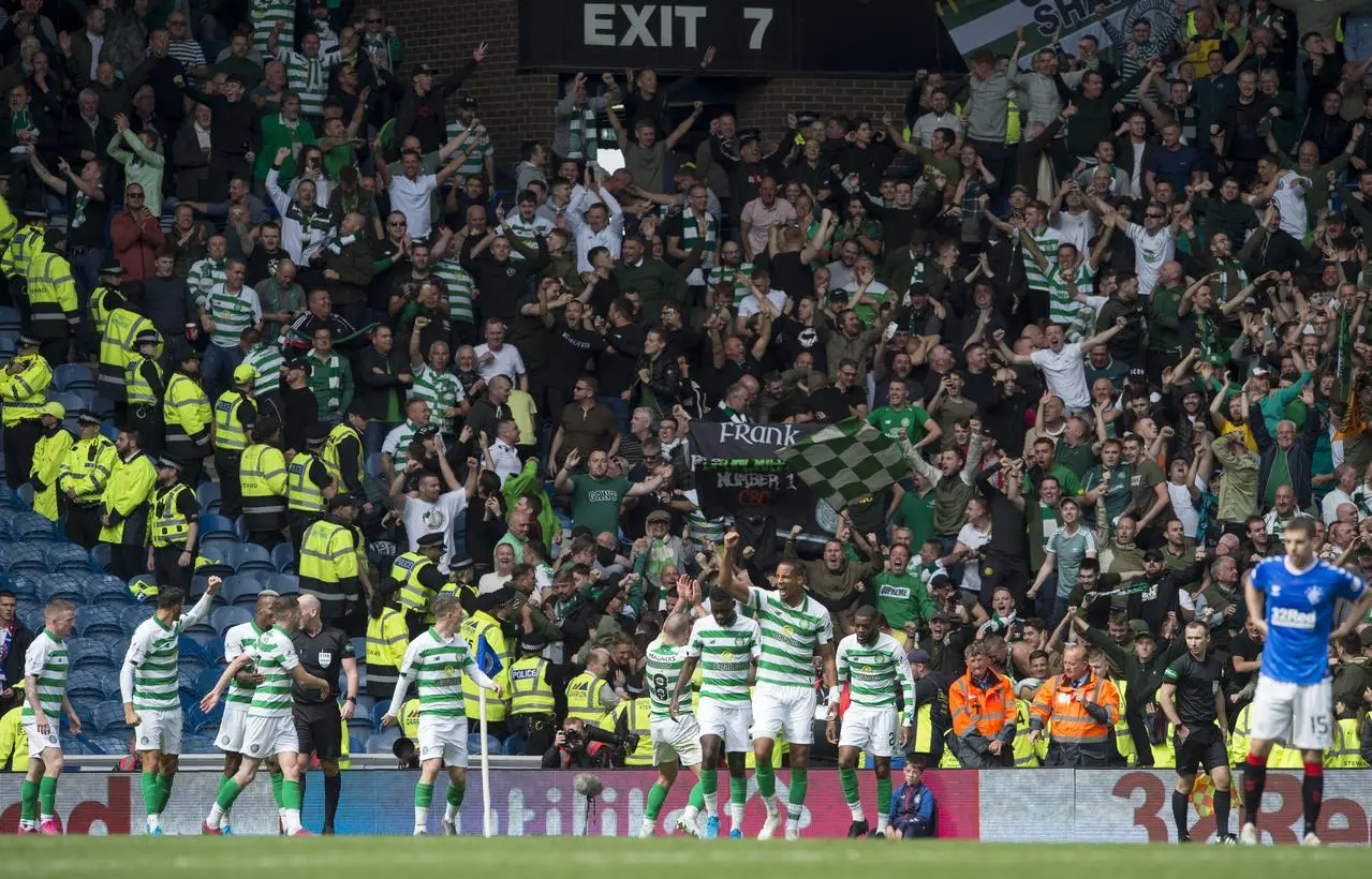 Celtic fans celebrate at Ibrox