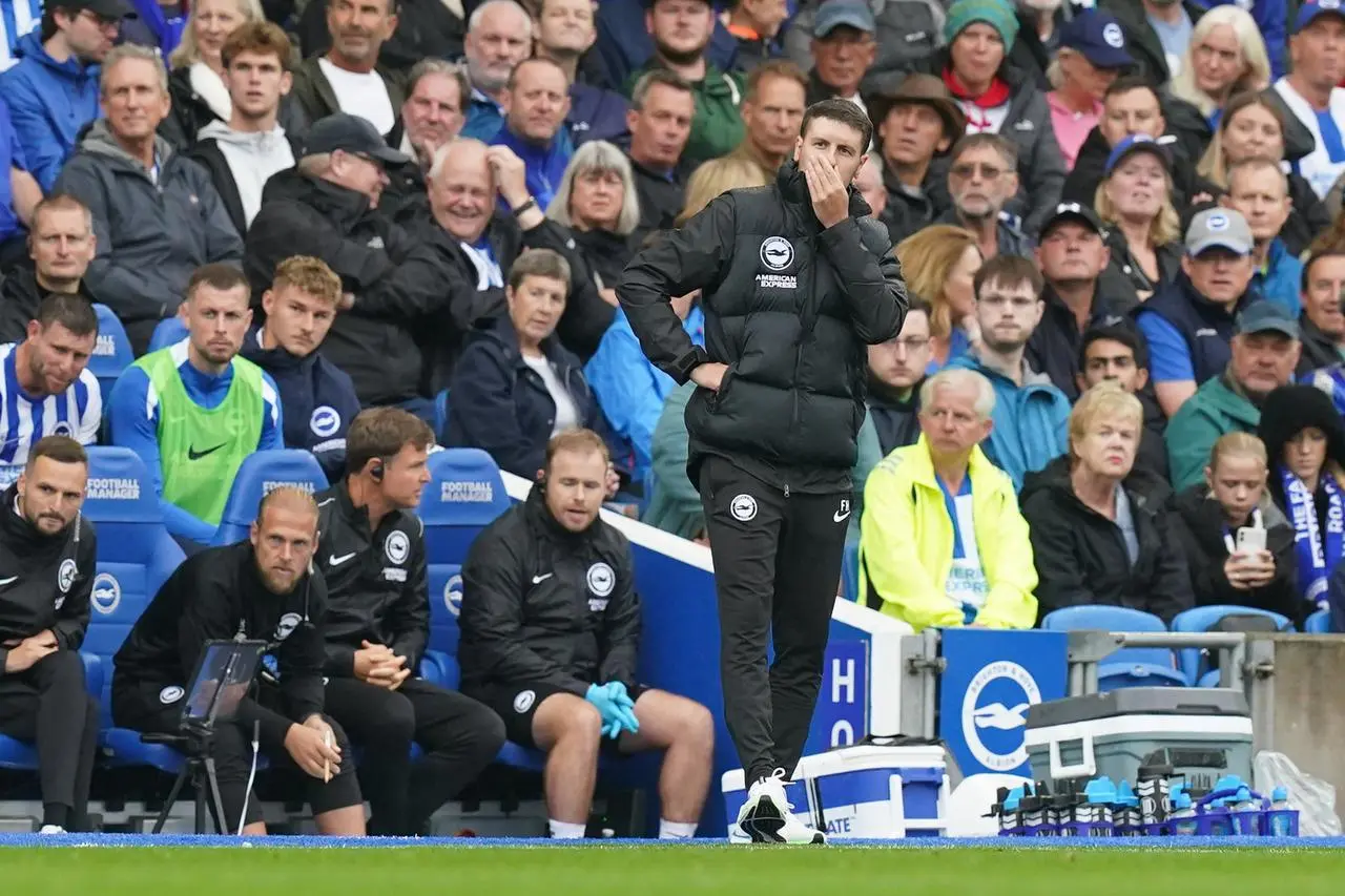 Brighton boss Fabian Hurzeler covers his mouth on the touchline