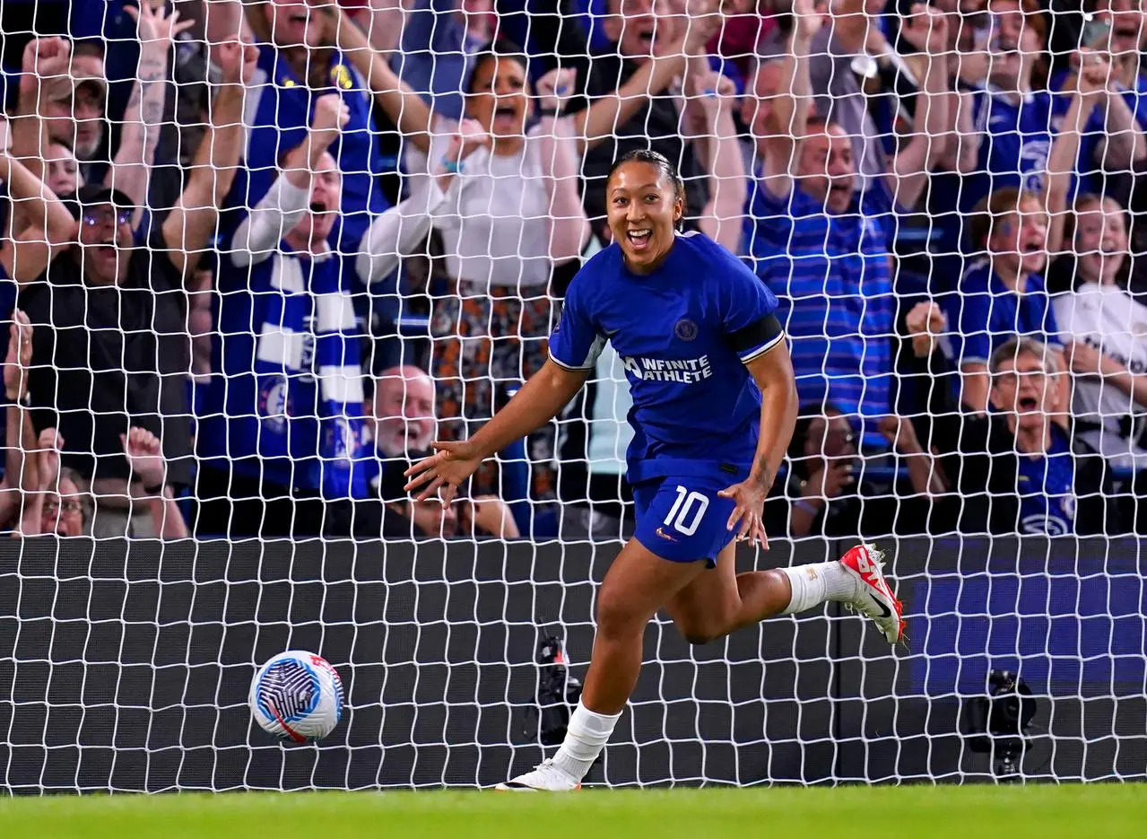 Chelsea's Lauren James turns away in celebration after scoring against Tottenham