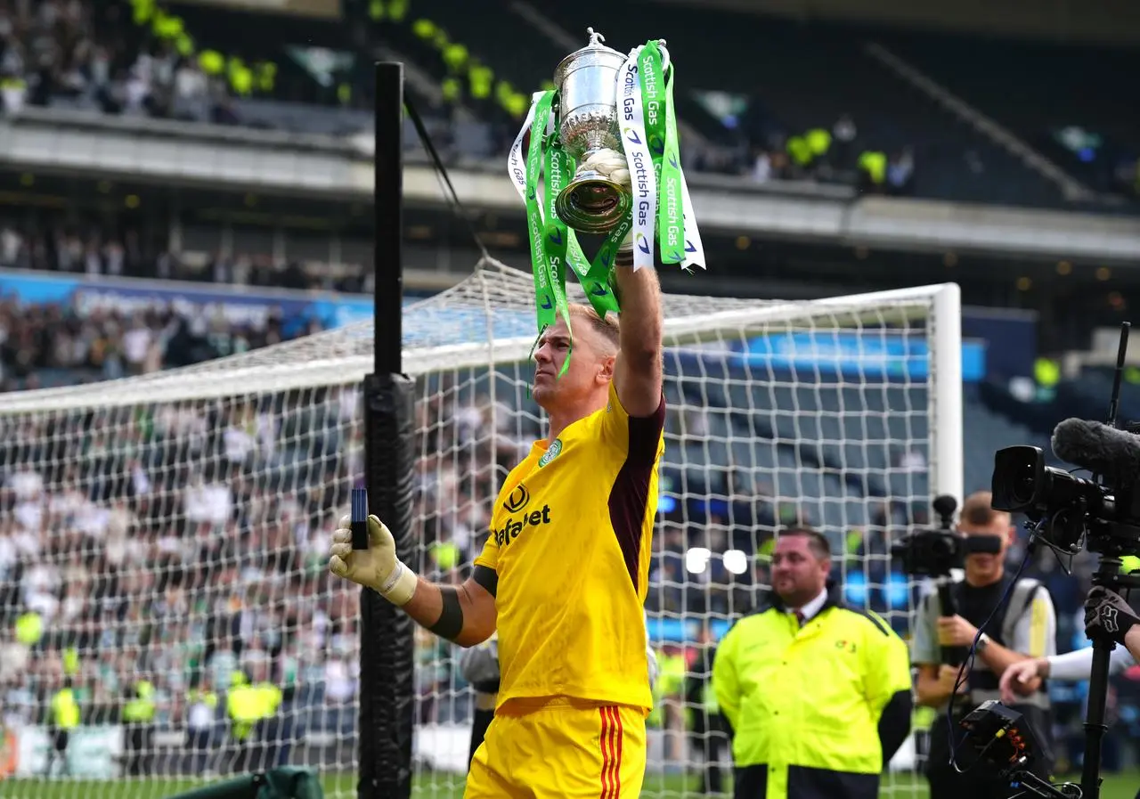 Joe Hart lifts the Scottish title aloft