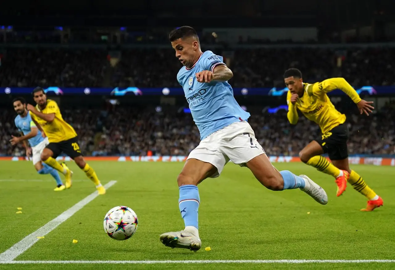 Joao Cancelo running with the ball