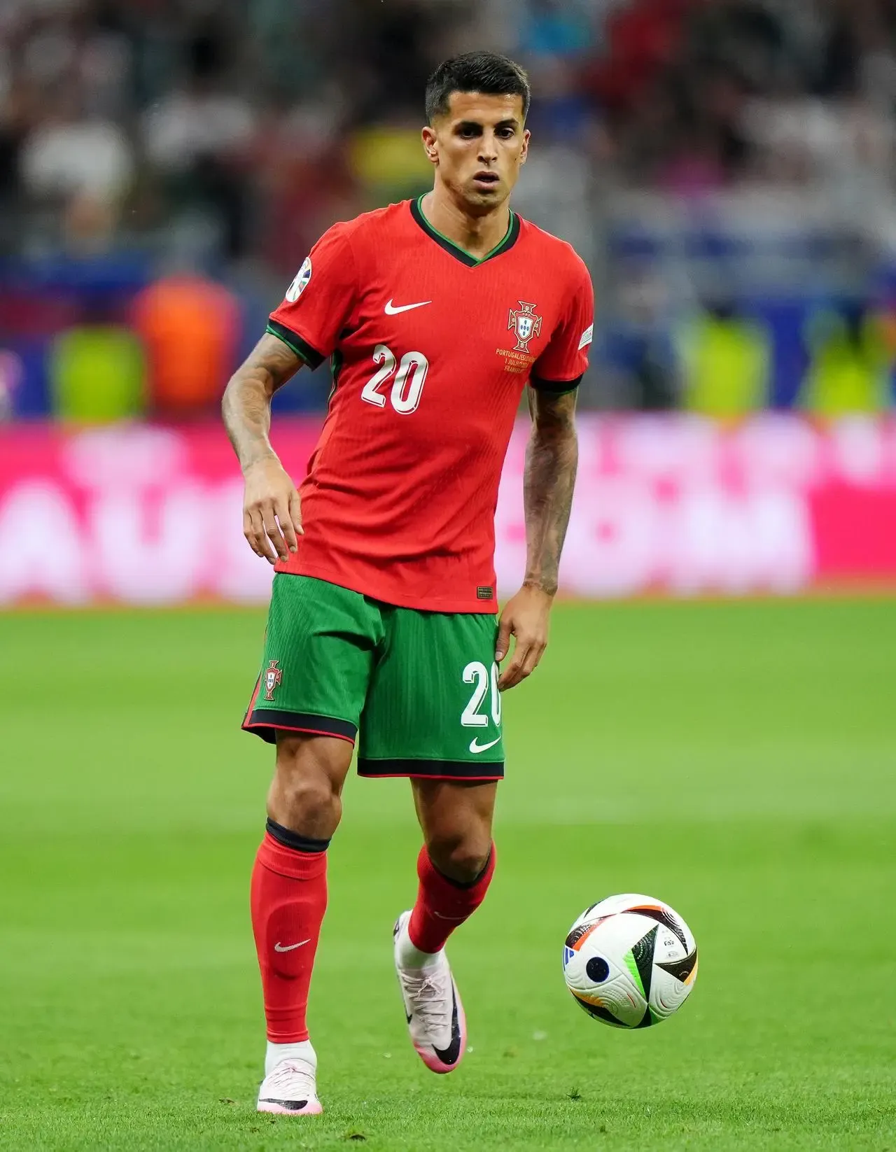 Cancelo kicking the ball for Portugal