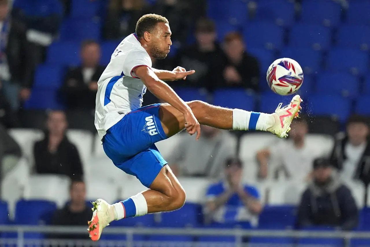 Rangers' Cyriel Dessers leaps to control the ball in a pre-season friendly at Birmingham