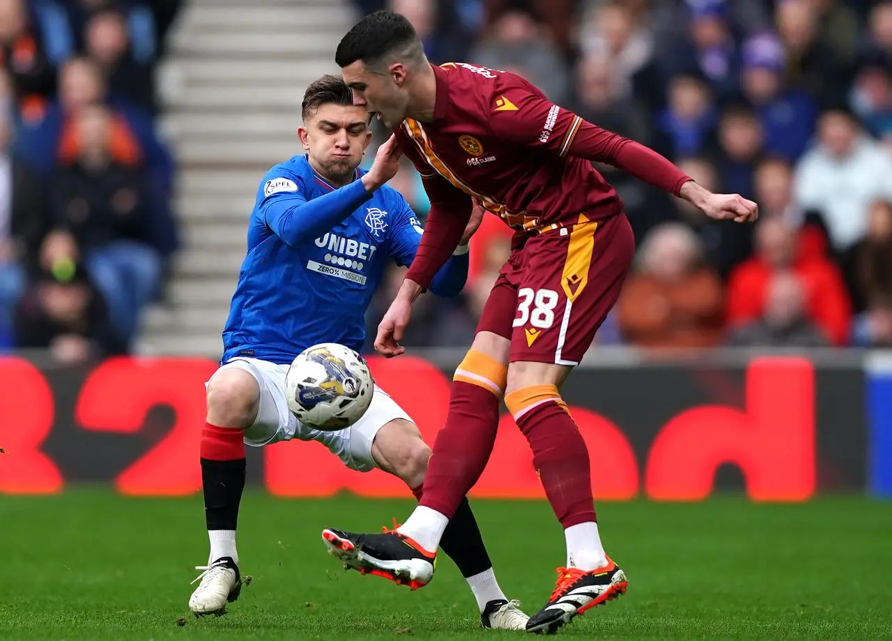 Lennon Miller, right, competes for the ball against Rangers