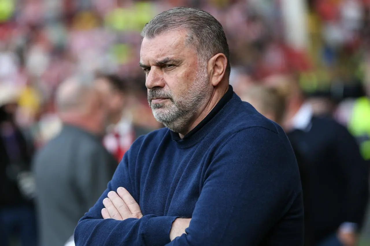 Tottenham manager Ange Postecoglou stands with his arms folded ahead of last season's Premier League match at Sheffield United