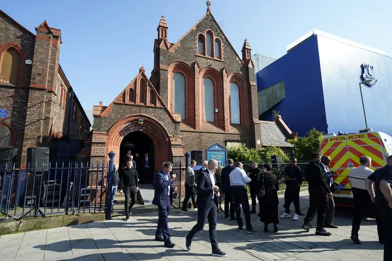 Ian Woan leaves the St Luke's Church following Wednesday's memorial ceremony