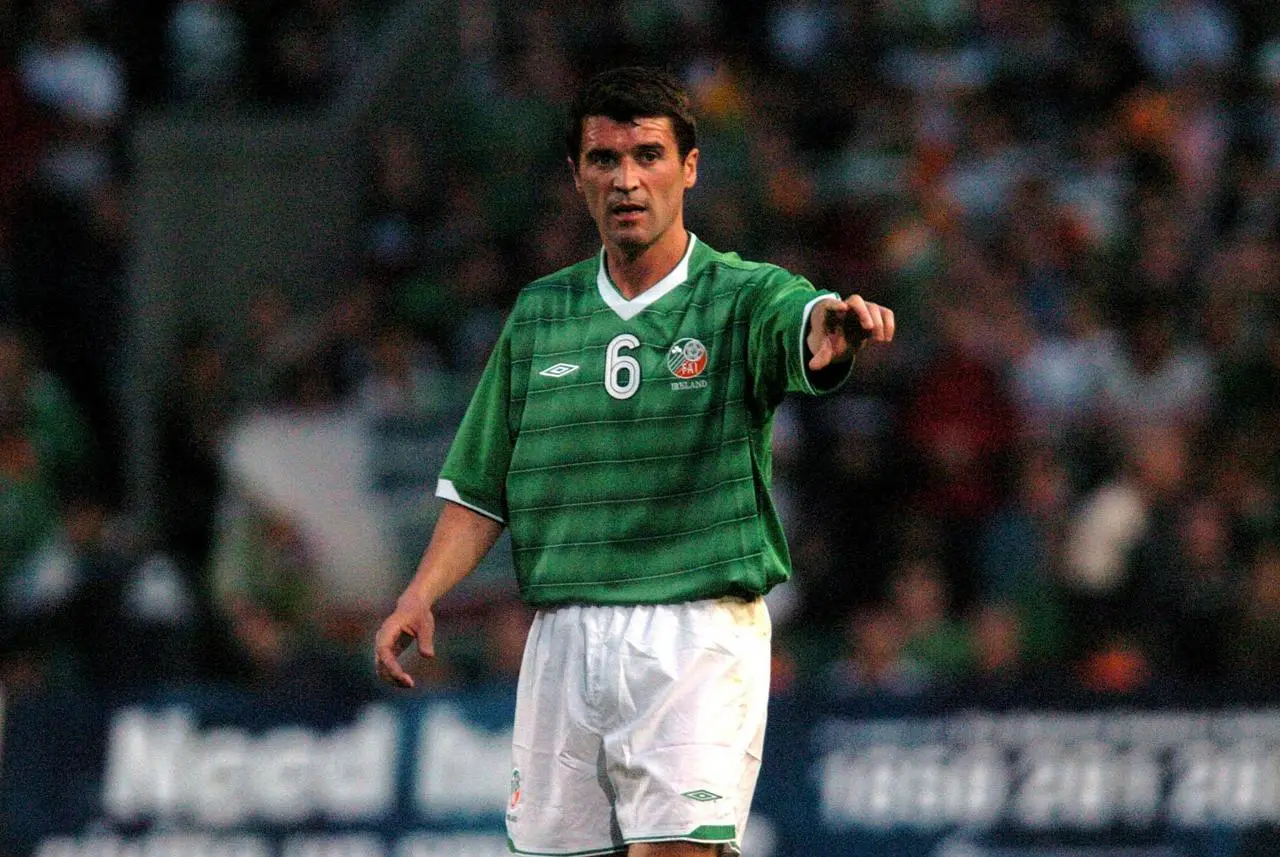 Manchester United and Republic of Ireland player Roy Keane calls out instructions to his team-mates during a game against Romania