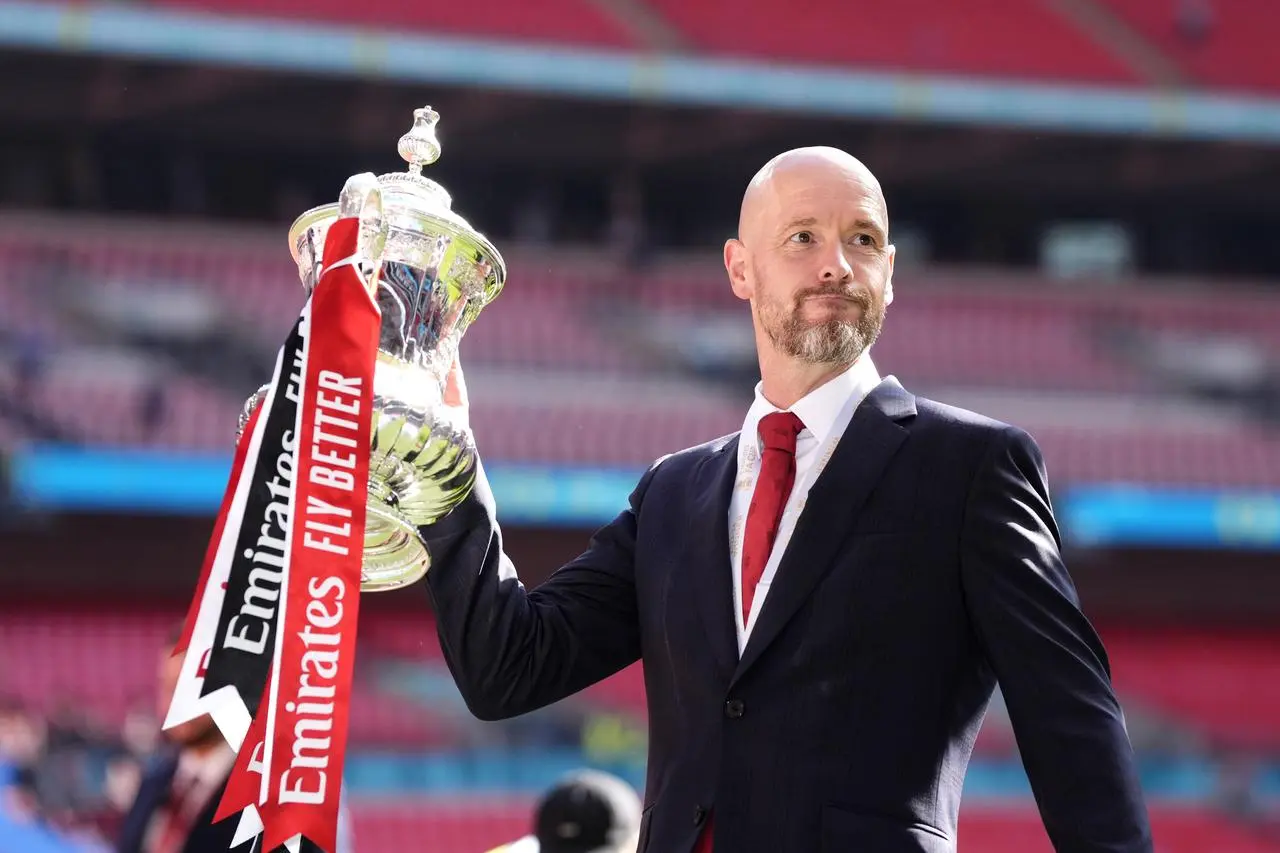 Manchester United boss Erik ten Hag lifts the FA Cup at Wembley